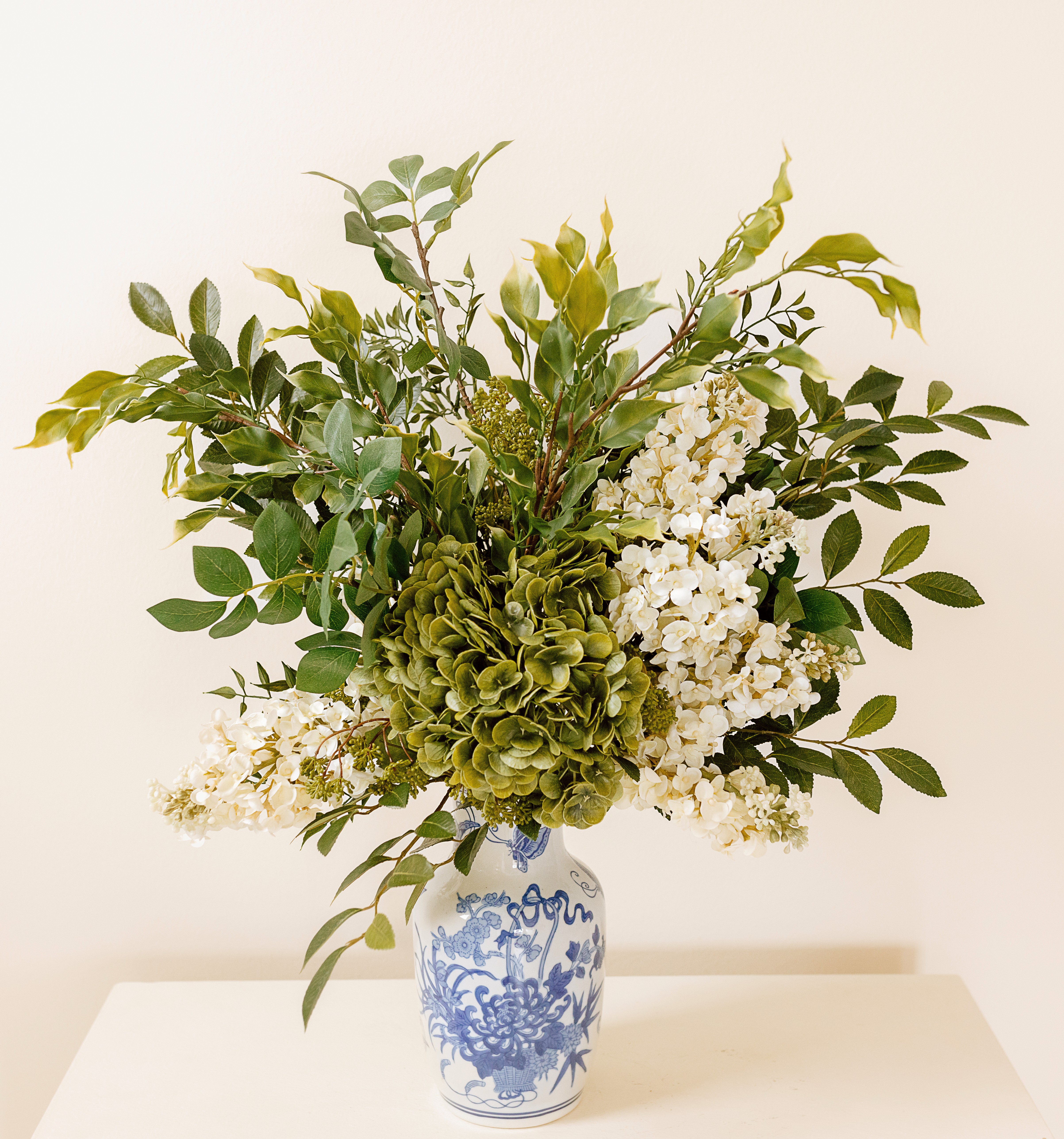 Drawing Room floral collection featuring sculptural branches and elegant botanical arrangements